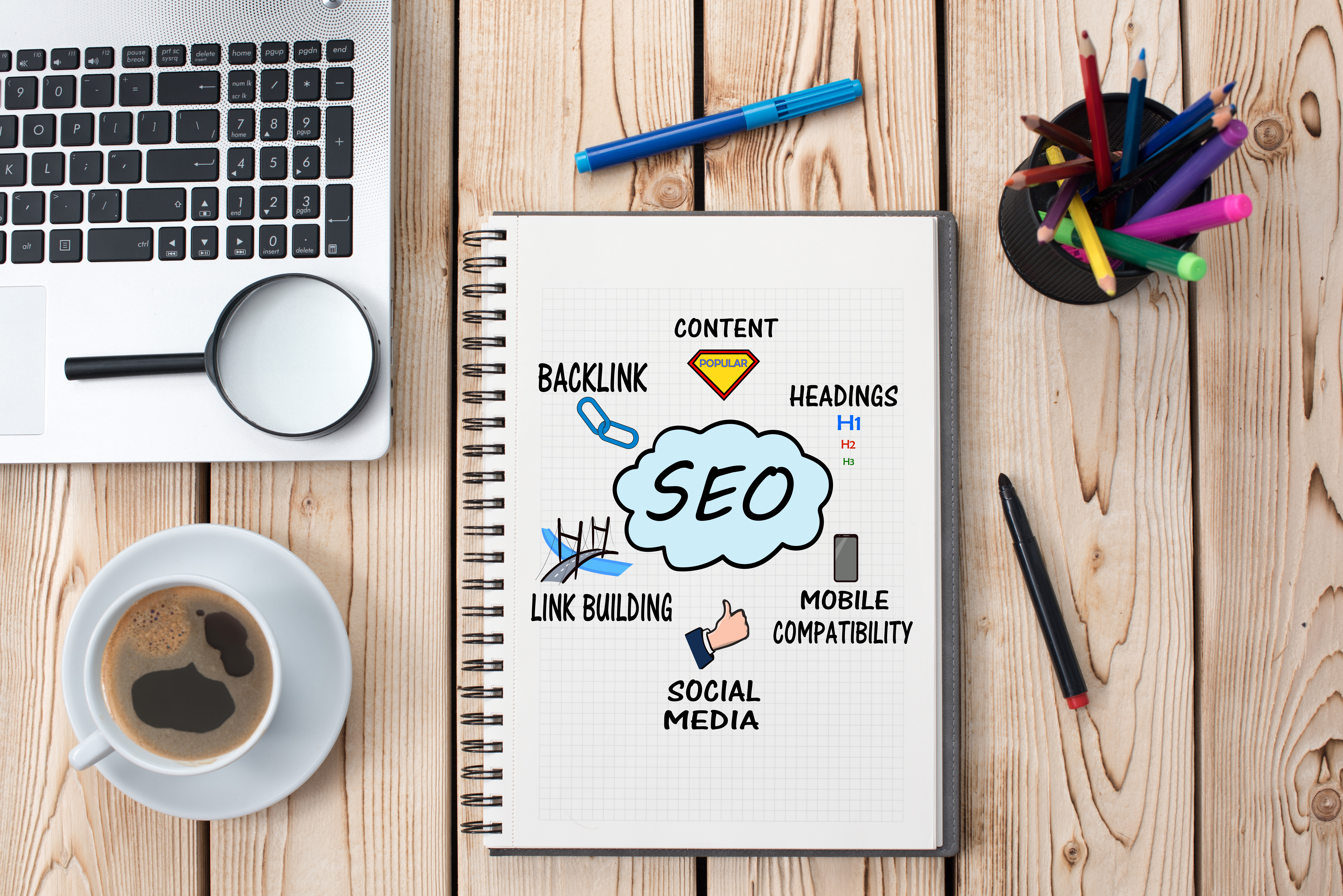 Manual on desk with SEO infographics